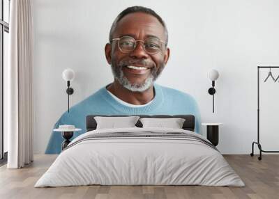 Middle aged dark skinned man achieves success with smile Wall mural