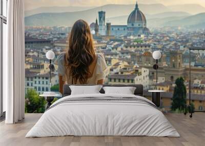 Rear view of woman looking at Florence cityscape in Italy  Firenze  tour tourism  travel destination Wall mural