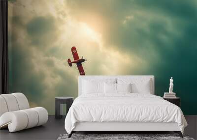 Close-up of a toy airplane flying through a cloudy sky, captured with dramatic lighting and motion blur Wall mural