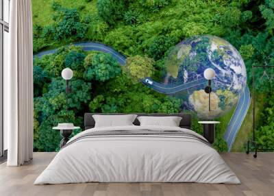 Electric car and EV electrical energy for environment, EV car on forest road with earth planet going through forest, Ecosystem ecology healthy environment, Electric car with nature, Save earth energy. Wall mural