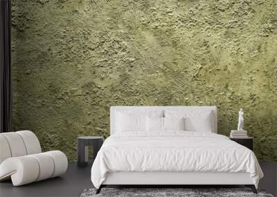 A close-up shot of a wall with a grainy, textured surface painted in a muted olive green hue Wall mural