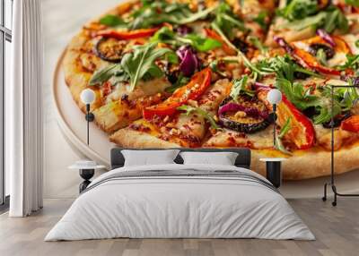 A delectable vegan pizza garnished with vibrant bell peppers, arugula, and herbs rests on a white plate, illuminated by soft natural light in the background Wall mural