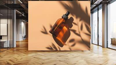 Amber glass serum bottle with dropper, botanical shadow overlay, beauty product mockup. Wall mural