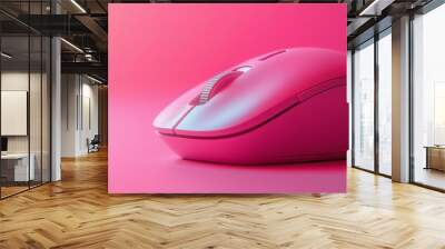 A smooth, minimalistic pink wireless mouse with a scroll wheel, placed on a matching pink background Wall mural