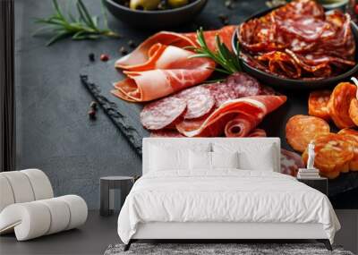 Charcuterie board on black background. Italian antipasti or Spanish tapas Wall mural