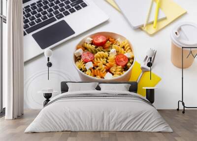 Food in taking away boxes on white table with laptop Wall mural