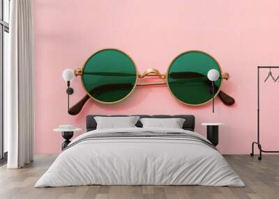 Vintage fashionable round green sunglasses on pink background Wall mural