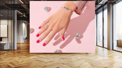 Womans hand with pink nail design. Manicure, pedicure beauty salon concept. Trendy color Wall mural