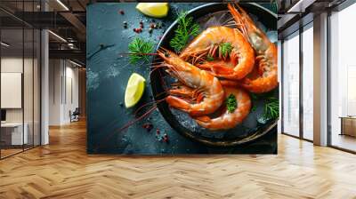 Healthy food. Fresh shrimps with ice close-up on plate on dark background with copy space top view Wall mural