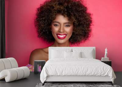 Cheerful black woman with curly hair Wall mural