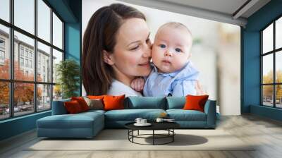 Portrait of mother and child laughing and playing Wall mural