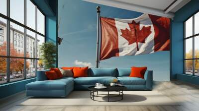 Canada flag against a blue sky. Wall mural