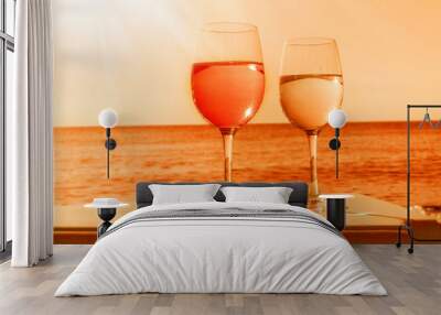 Two glasses by sea in orange Wall mural