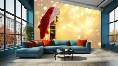 Acoustic Guitar with red Santa hat and light garland. Christmas music song concept with copyspace Wall mural