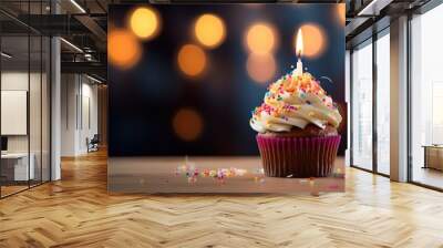 Delicious tasty cupcake with candle on dark background. Wall mural