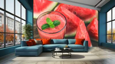 A glass of fresh watermelon juice on a wooden board background Wall mural