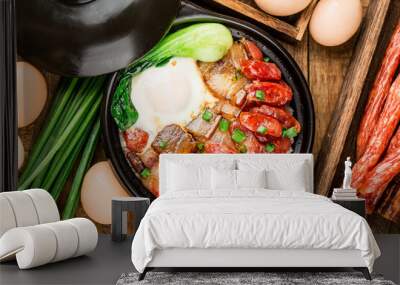 Cantonese style cooking of claypot rice with waxed meats Wall mural