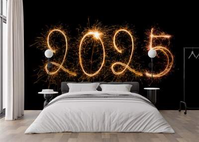 Happy New Year 2025. Burning sparkling text 2025 isolated on black background. Wall mural