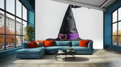 Black witch hat with purple ribbon on white background. Halloween concept. Wall mural