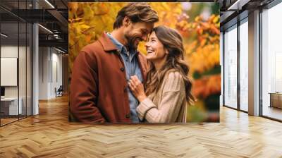 couple sharing laughing in the autumn  park Wall mural