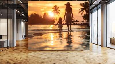 mom and child walking in sunset on the beach Wall mural