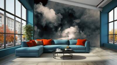 A mystical concept of a man on a road floating in the sky. Looking at the bright light of heaven surrounded by clouds. Wall mural