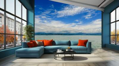 Beautiful scenic view of Mamutik Island’s turquoise waters and cloudy skies in Malaysia on a calm day Wall mural