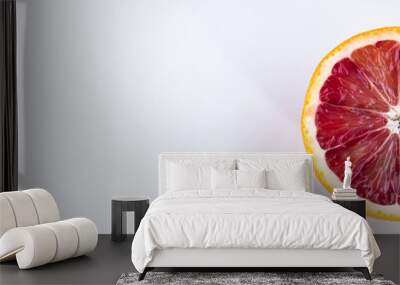 Single half of a blood orange isolated on white Wall mural