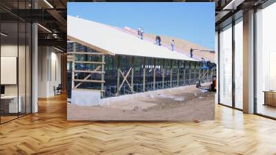 construction workers roof a barn Wall mural