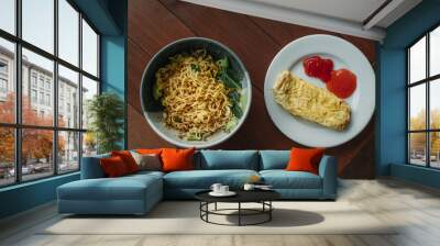 A bowl of instant noodle and omelette in the wooden table Wall mural