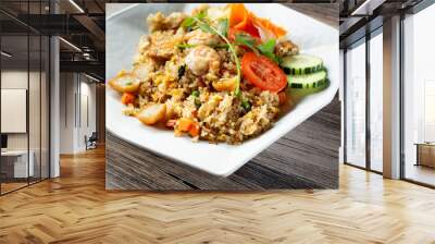 A view of a plate of seafood fried rice. Wall mural