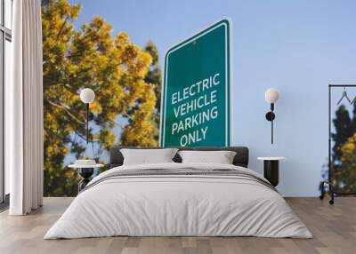 A view of an electric vehicle parking only sign. Wall mural