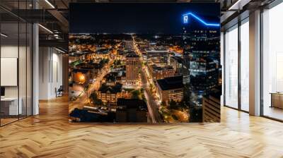 Aerial photograph of the Lexington, Kentucky skyline at night with the city alite. Wall mural