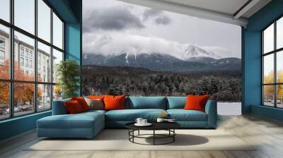 Beautiful winter landscape, mountain in the clouds and snow covered trees. Katahdin, Maine, USA Wall mural