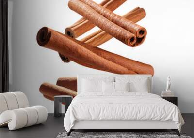 Flying cinnamon sticks, on a white background
 Wall mural