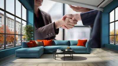 Business handshake for teamwork of business merger and acquisition,successful negotiate,hand shake,two businessman shake hand with partner to celebration partnership and business deal concept
 Wall mural