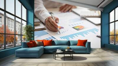 Business man hands hold documents with financial statistic stock photo,discussion and analysis data the charts and graphs. Finance concept Wall mural