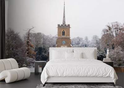 Traditional English village church covered in Snow. St Andrews Church, Much Hadham, Hertfordshire. UK Wall mural