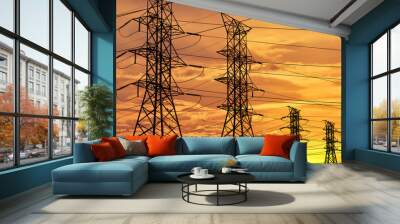 Silhouette of high voltage power line cables in an orange evening sunset Wall mural