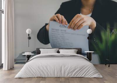 Close up of Young Business woman tearing contract at her office, Breaking contract concept Wall mural