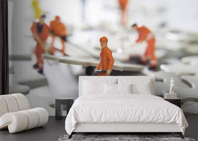 worker figurines placed with puzzle pieces Wall mural