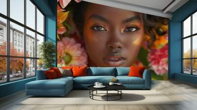 A black woman is surrounded by flowers and has her face painted with gold and orange colors. The image has a warm and vibrant mood, with the flowers and makeup creating a sense of beauty and elegance Wall mural