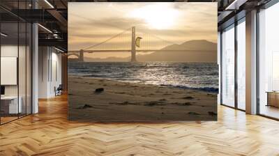 Golden Gate Bridge with a windsurf sail and a brown gold sky.  Wall mural