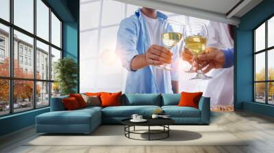 Happy friends having fun indoors, Wine and cheese are served for a friendly party or a celebration. Wall mural