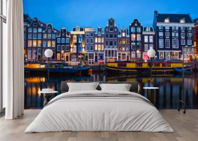 Amsterdam canal  with typical dutch houses and houseboats at evening with beautiful water reflections, Holland, Netherlands.  Wall mural