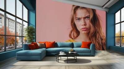 sad young woman on pink background Wall mural