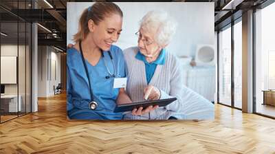 Tablet, nurse or doctor consulting an old woman in a nursing home bedroom with blood pressure and heart test results. Smile, trust and happy healthcare worker with a senior persons medical report Wall mural