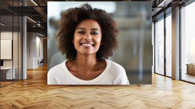 her smile is infectious. portrait of a smiling young woman at home. Wall mural