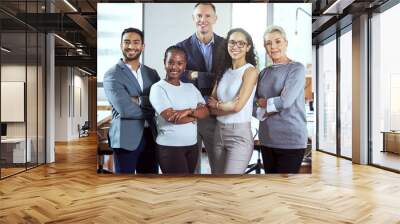 Theyre all about their business. Shot of a group of businesspeople standing in an office at work. Wall mural