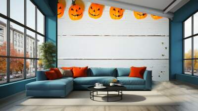 hanging jack o lantern halloween decorations on white background Wall mural